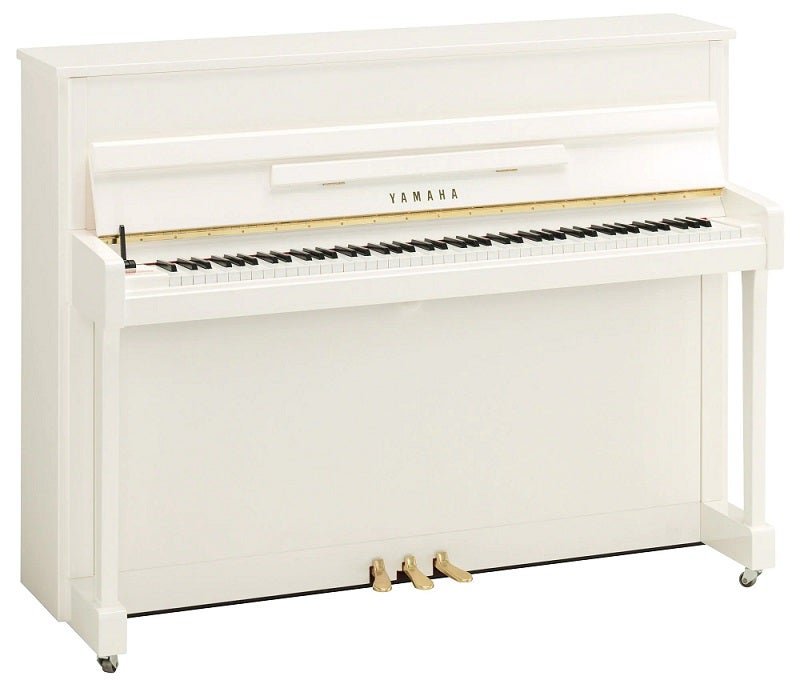 美しい仕上げの白いピアノ。